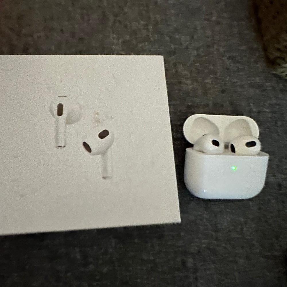 New AirPods (3rd generation) with Lightning Charging Case worn once.